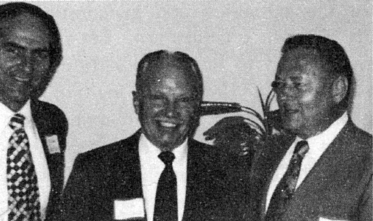 Black and White photograph of Dr. Allen Jackson (I.), president of Huntingdon College, and Lew Hollard (c.), director of the Management Center at the college, discuss chapter plans with James Rutherford, the new chapter's president.