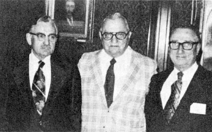 Black and White Photo at a meeting of the Washington, D.C., chapter, William Kirby, Jr. (r.), new international president of S.A.M., discusses plans for the year ahead with Hal J. Batten (l.), new international chairman, and Charles Scott, outgoing president of the Washington chapter.