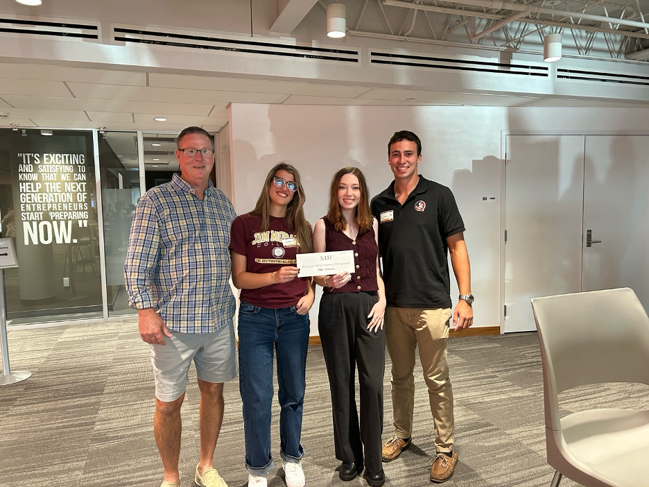 Photo of Bob Garner, Jules Johannemann and Austin at the Club Signup Event at FSU